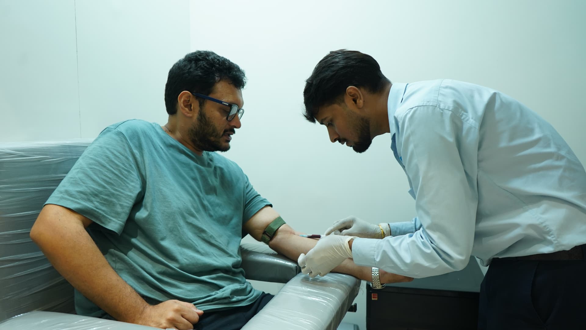 Phlebotomist drawing a blood sample